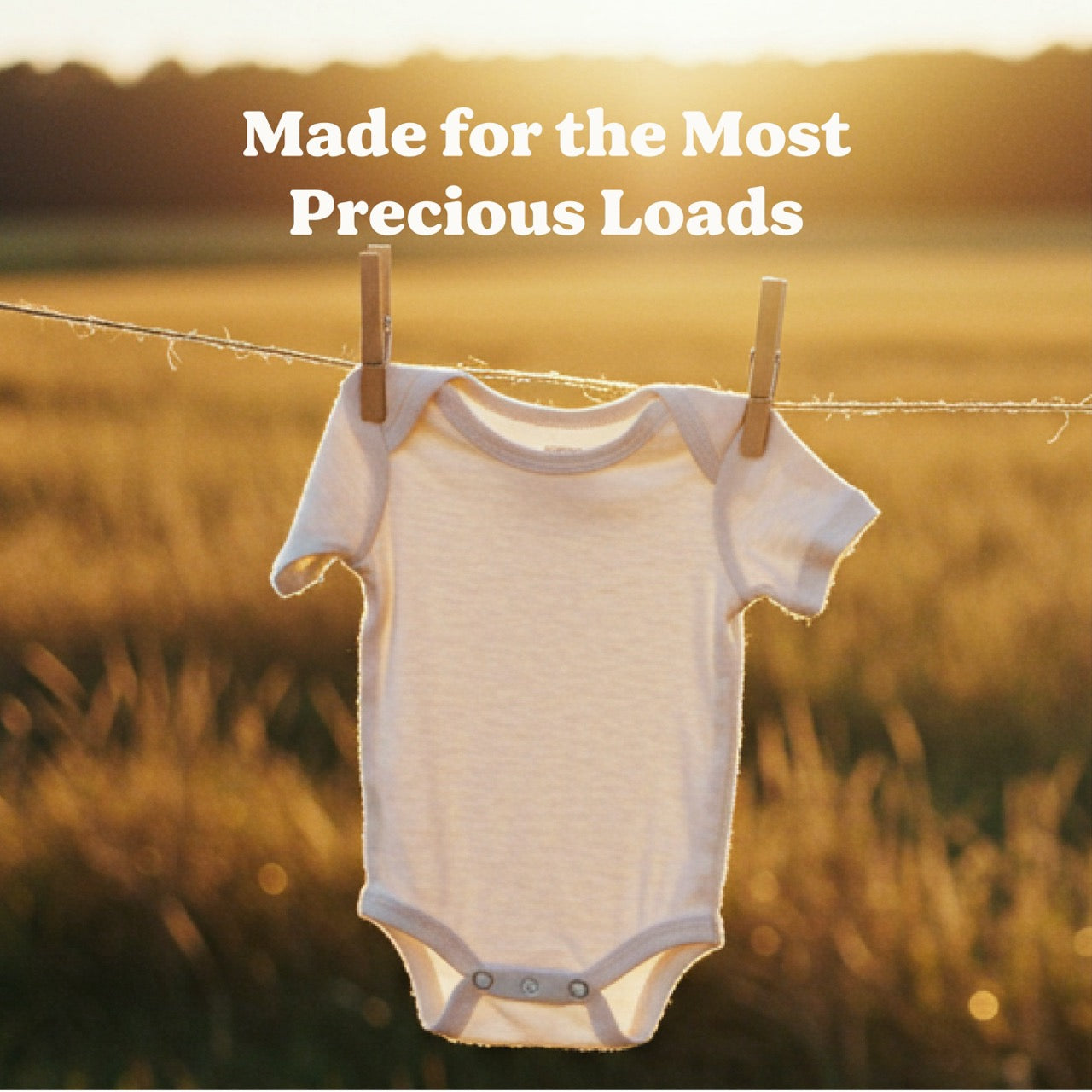 Baby clothes hanging outside representing clean laundry washed with gentle ingredients