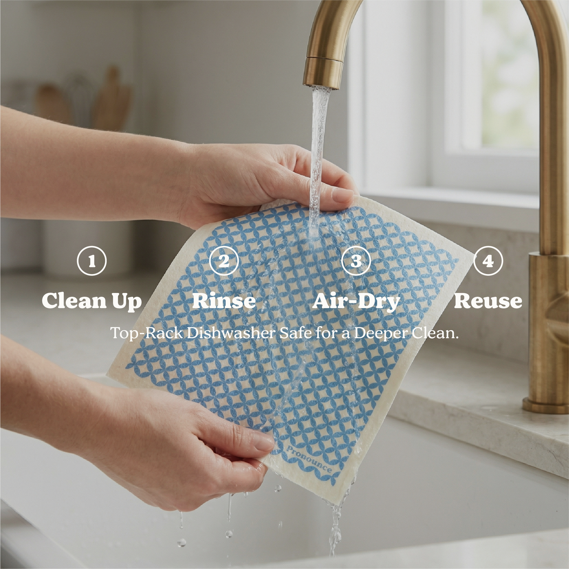 Person washing a reusable dishcloth under running water in a kitchen sink