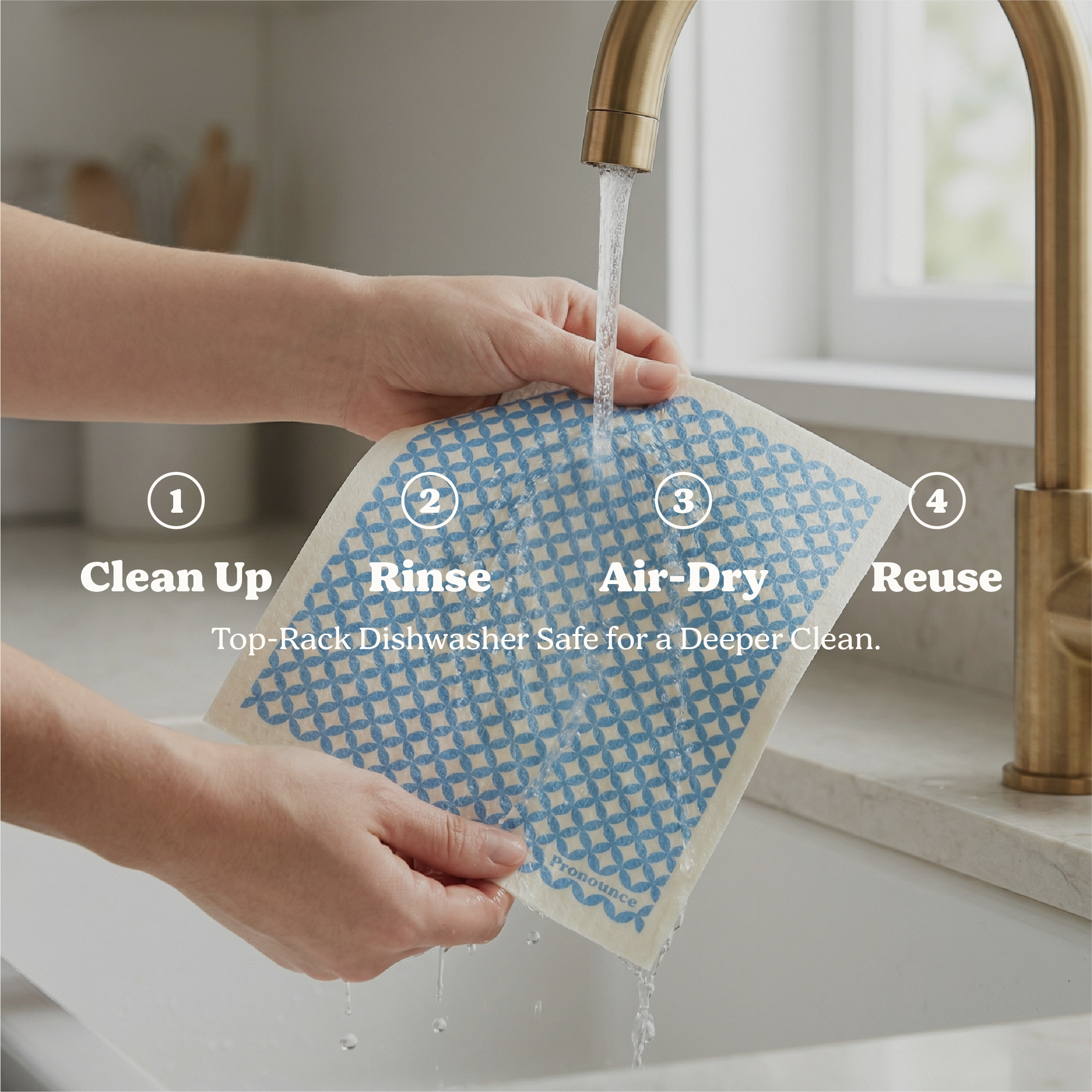 Person washing a reusable dishcloth under running water in a kitchen sink