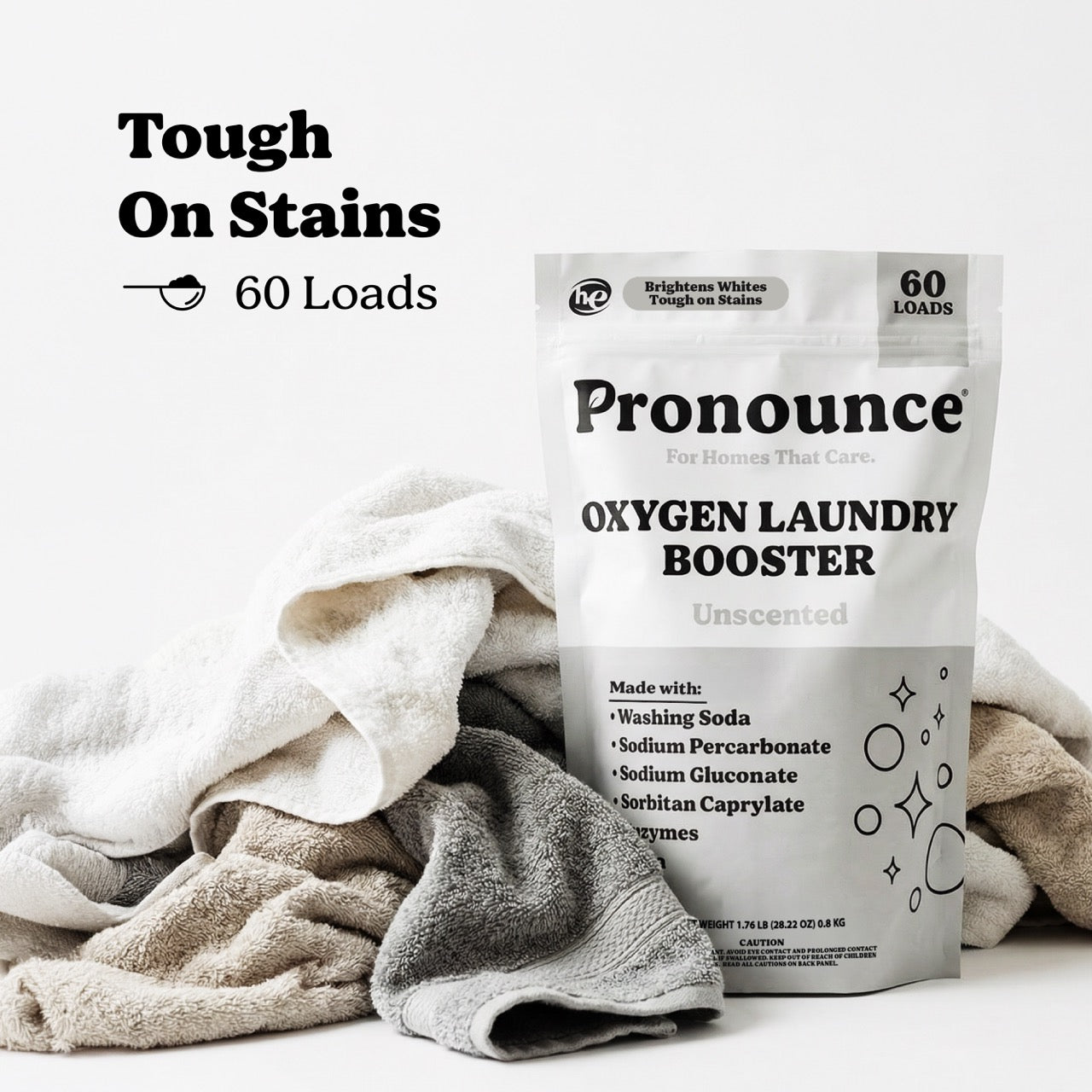 Laundry stain fighter with oxygen booster and enzyme power showing clean towels after washing