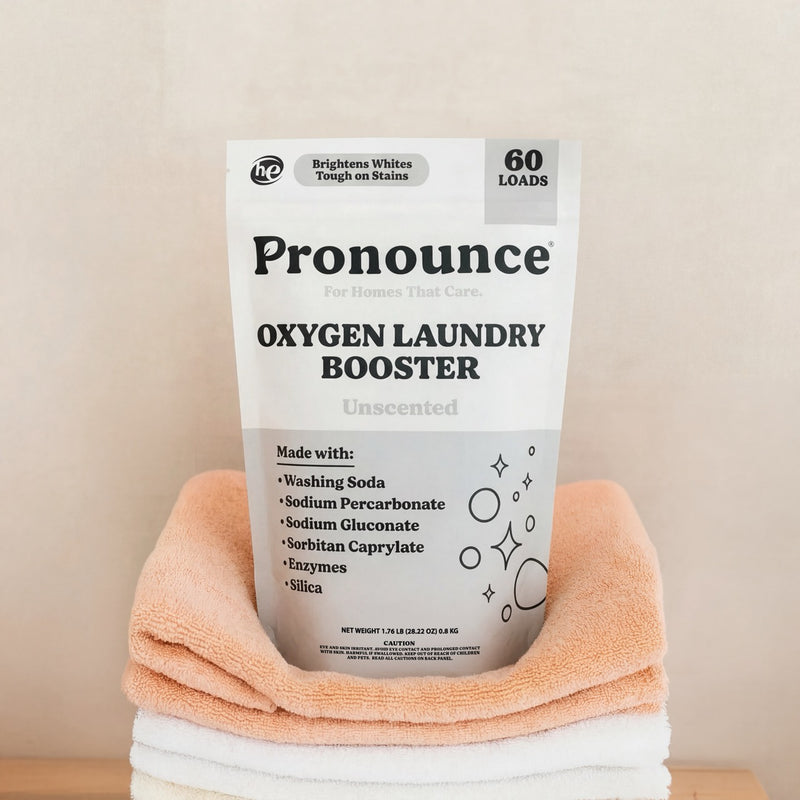 Pronounce unscented oxygen laundry booster powder bag showing 60 loads on folded towels