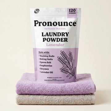 Pronounce lavender laundry powder bag showing 120 loads on folded towels