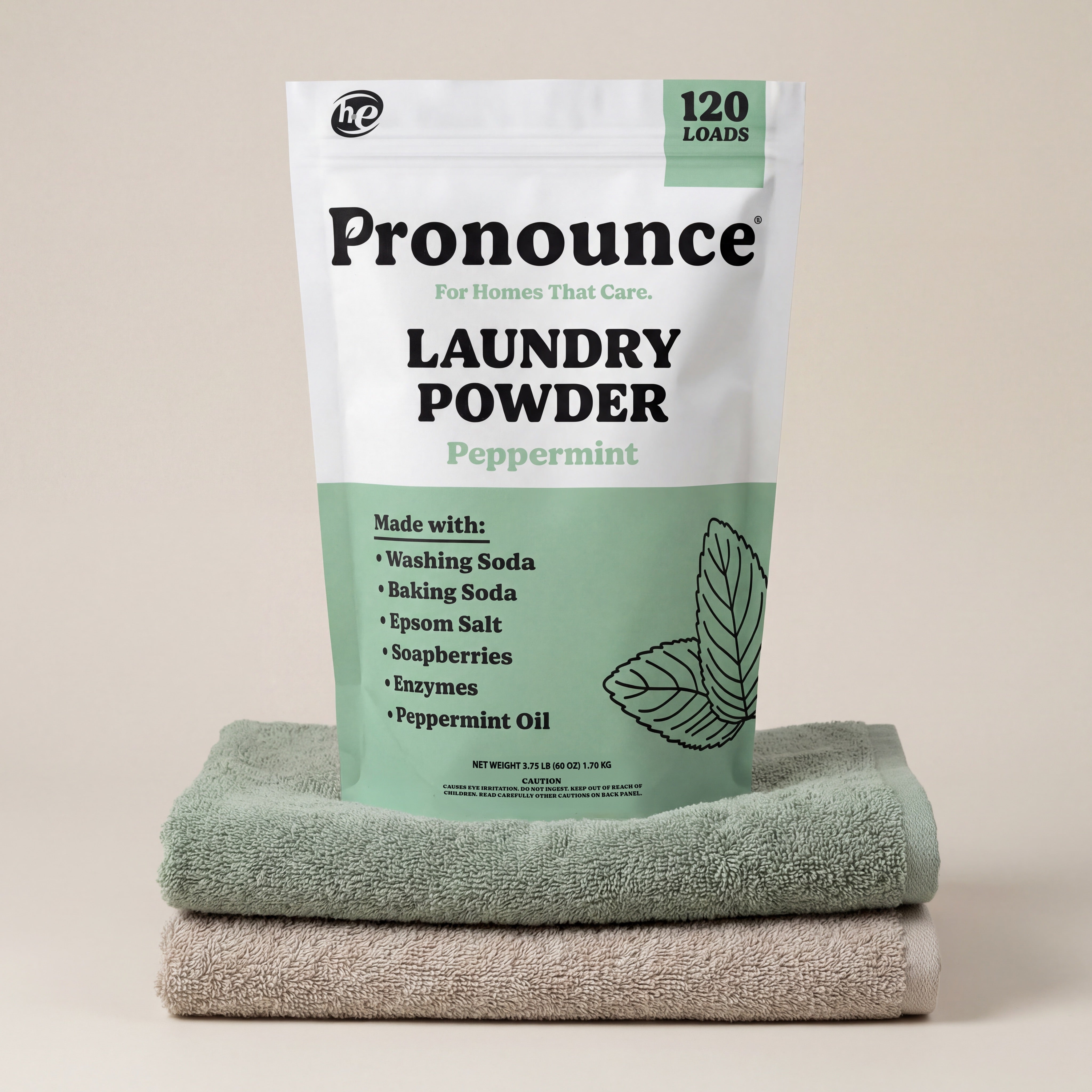 Pronounce peppermint laundry powder bag showing 120 loads on folded towels