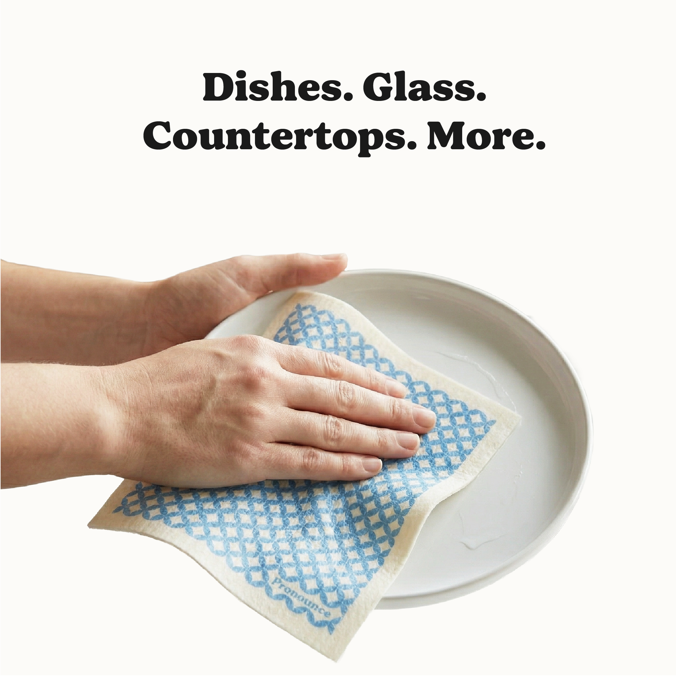 Swedish dishcloth being used to clean a plate showing multi-surface use
